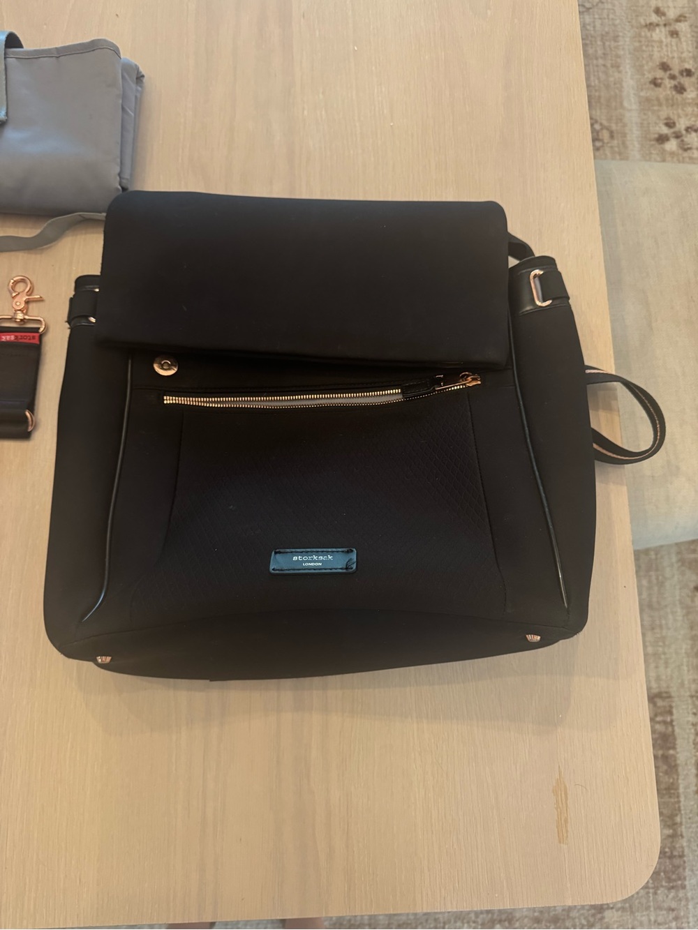 Storksak Black Baby Bag with Gold Hardware